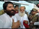 Godman Asaram Bapu with his son.