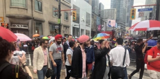 Navdeep Bains walks in Toronto Pride parade