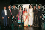 Anu and Arun Srivastava and their family seen with Pooja Batra, AIM for SEVA Canada founder Dr Terry Papneja (second from left), Mrs Papneja (four from right) and others